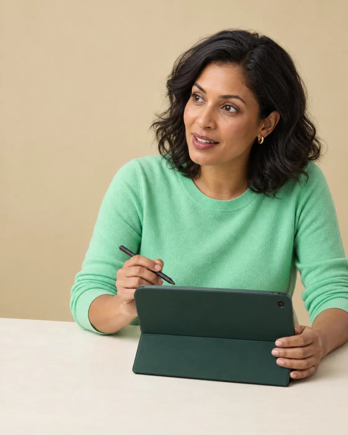 Illustrative reimbursement reviewer discussing a case using a tablet